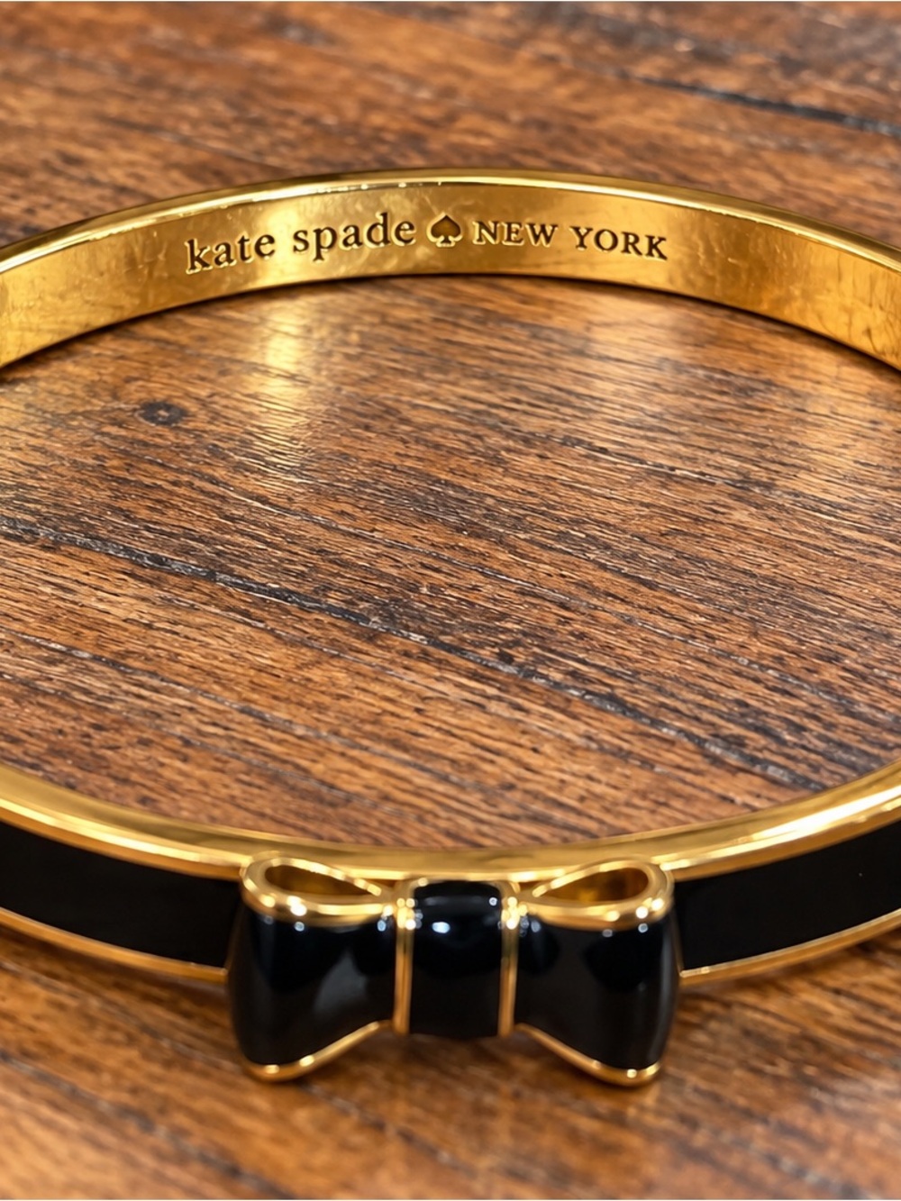 kate spade Gold-Tone Bangle with Black Enamel Bow